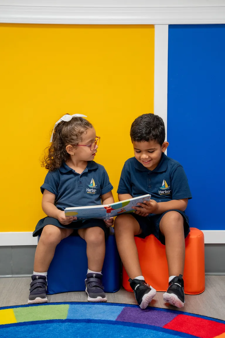 Smiling girl holding a picture book